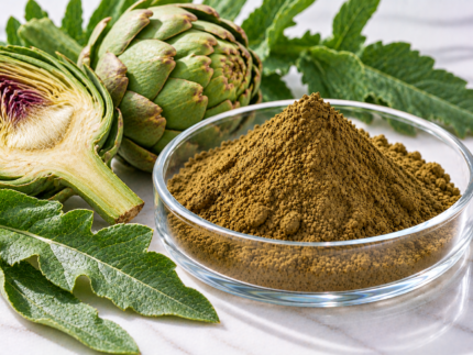 Artichoke Extract brown-green powder in a glass dish with fresh whole and sliced artichokes