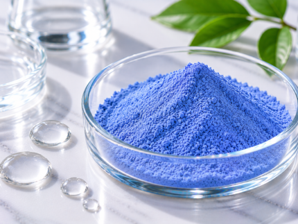 Copper Tripeptide-1 (GHK-Cu) blue cosmetic peptide powder in a glass dish