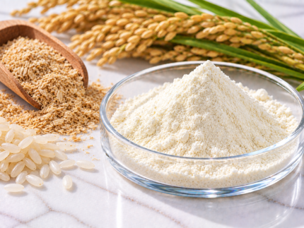 Ferulic Acid powder in a glass dish with rice grains and rice stalks for cosmetic formulations